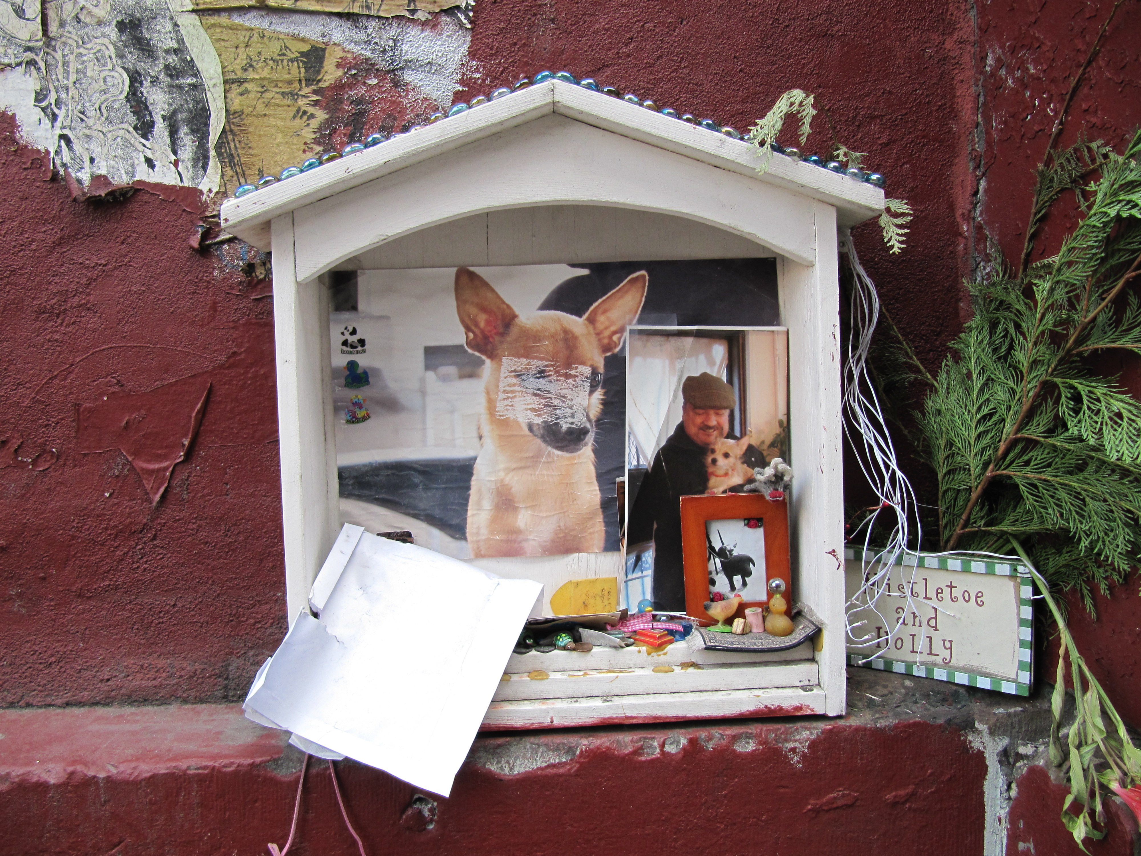 A diorama-style altar for a deceased doggy